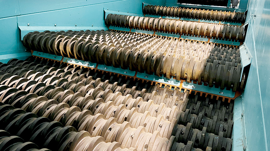 A closeup view of the inside of a Glass Breaker machine with it's screens.