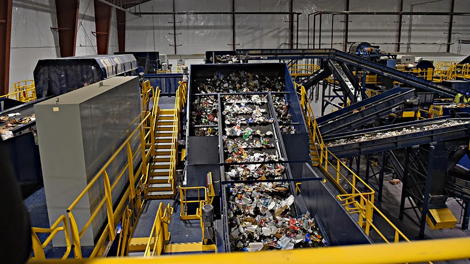 Image of LRS MRF conveyor belt running recycling materials.