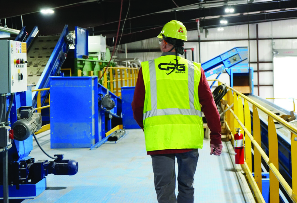 A field technician walking ahead in a MRF.