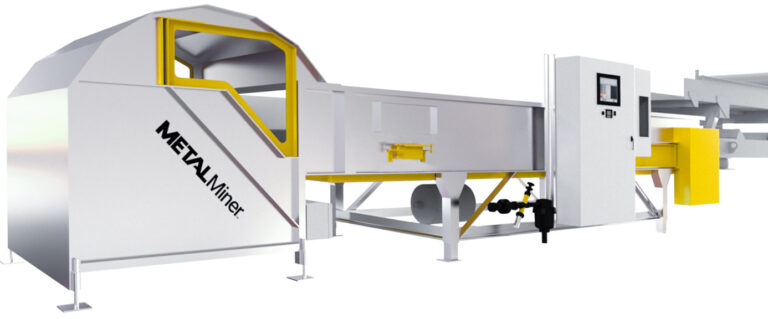 A large industrial optical sorting machine featuring a long conveyor belt and a control panel. The machine is primarily silver with yellow accents and labeled "METALMINER" on one side. It appears designed for processing or handling materials in a manufacturing setting.