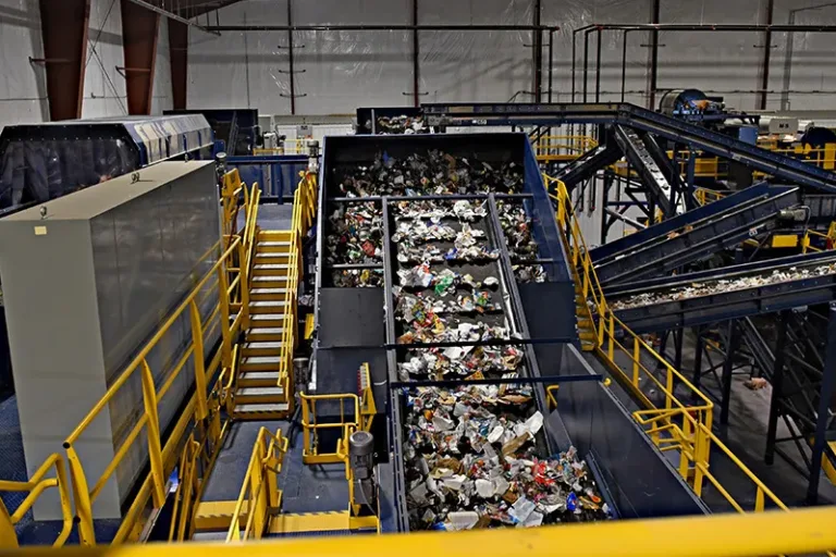 Image of LRS MRF conveyor belt running recycling materials.