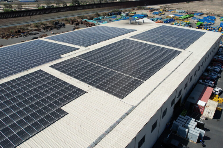 Image overview of a manufacturing building with a solar roof