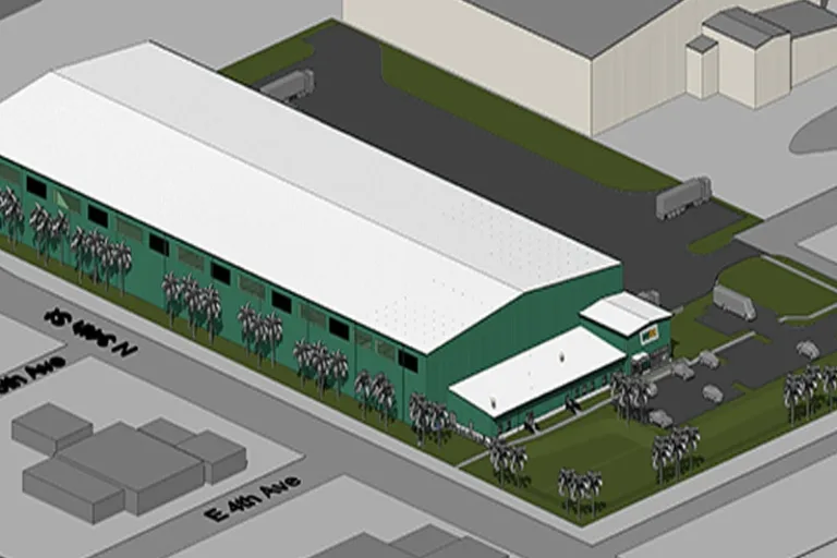 Aerial rendering of a long green industrial warehouse with a white roof, palm trees and parking on a corner lot.